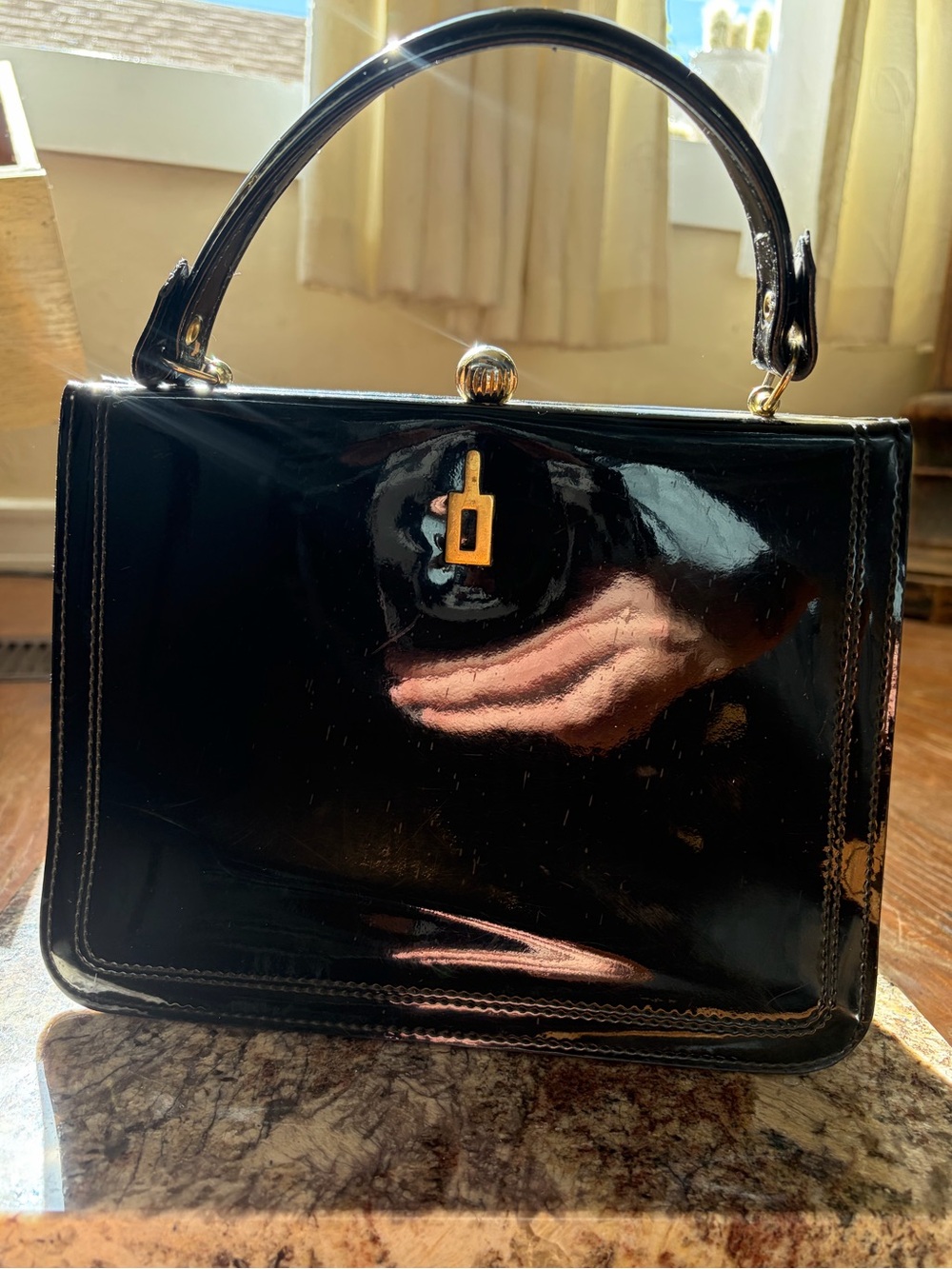 Dofan black patent leather purse with scarlet red lining and gold tone hardware